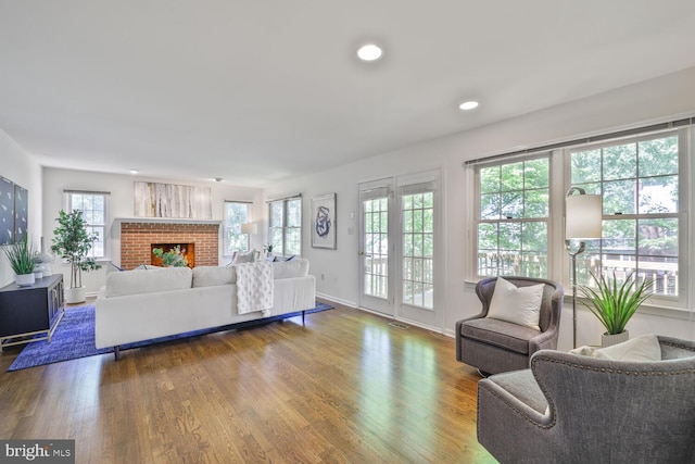 1531 Live Oak Dr, Silver Spring, MD 20910 - living area with wood finished floors, a fireplace, baseboards, and recessed lighting