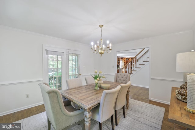 1531 Live Oak Dr, Silver Spring, MD 20910 - dining space featuring a chandelier, ornamental molding, stairs, wood finished floors, and baseboards
