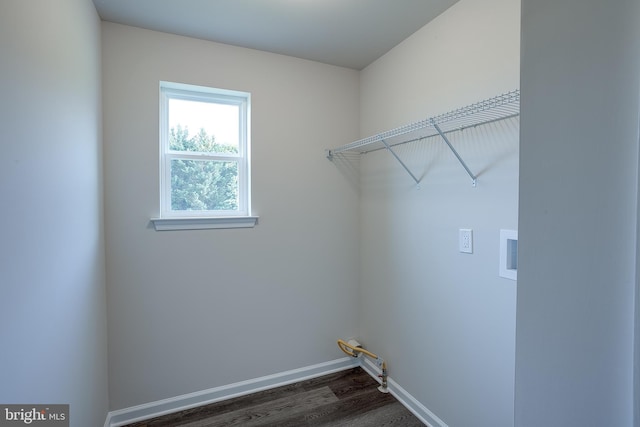 laundry area with laundry area, hookup for a washing machine, hookup for a gas dryer, dark wood-type flooring, and baseboards