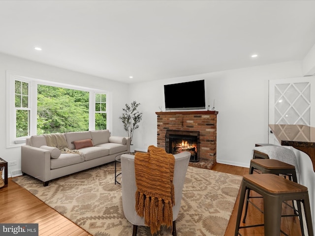 5306 Stone Rd, Frederick, MD 21703 - living area featuring a fireplace, wood finished floors, and recessed lighting