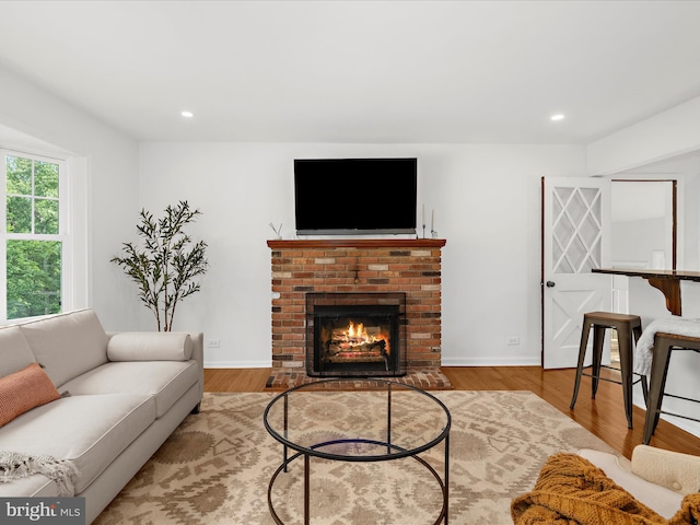5306 Stone Rd, Frederick, MD 21703 - living room with a fireplace, wood finished floors, and recessed lighting