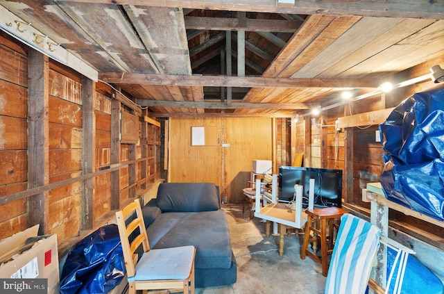 basement with wooden walls and wooden ceiling