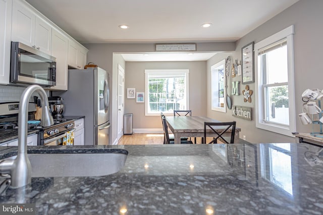 417 Princeton Ave, Cherry Hill, NJ 08002 - kitchen featuring stainless steel appliances, white cabinetry, recessed lighting, dark stone counters, and light wood finished floors