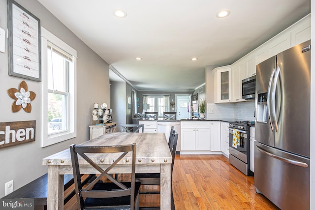 417 Princeton Ave, Cherry Hill, NJ 08002 - kitchen featuring appliances with stainless steel finishes, a peninsula, healthy amount of natural light, light wood-style flooring, and recessed lighting