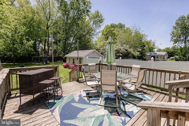 417 Princeton Ave, Cherry Hill, NJ 08002 - deck featuring outdoor dining space, an outdoor structure, and view of wooded area