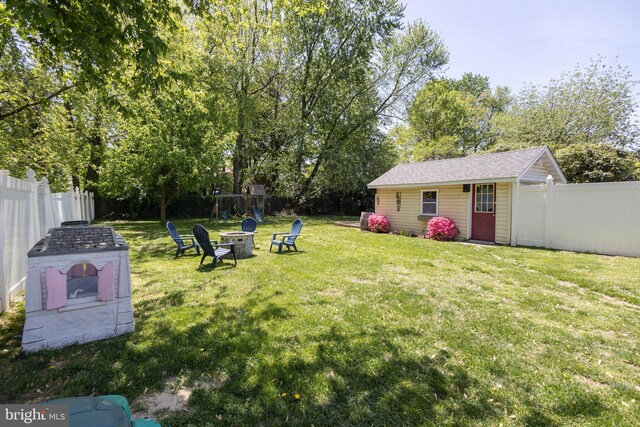 417 Princeton Ave, Cherry Hill, NJ 08002 - view of yard with an outdoor fire pit, an outdoor structure, and view of wooded area