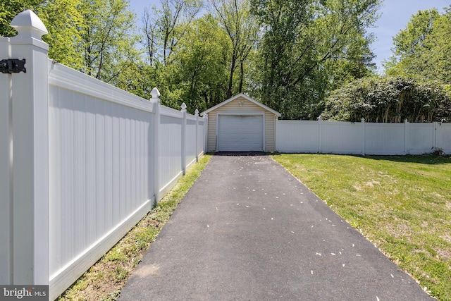 417 Princeton Ave, Cherry Hill, NJ 08002 - detached garage featuring asphalt driveway and view of wooded area