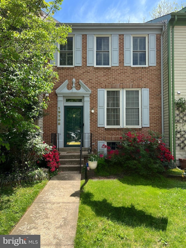 19208 Cross Ridge Dr, Germantown, MD 20874 - view of front of house featuring a front yard and brick siding