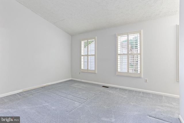 19208 Cross Ridge Dr, Germantown, MD 20874 - unfurnished room featuring a textured ceiling, carpet floors, baseboards, and vaulted ceiling