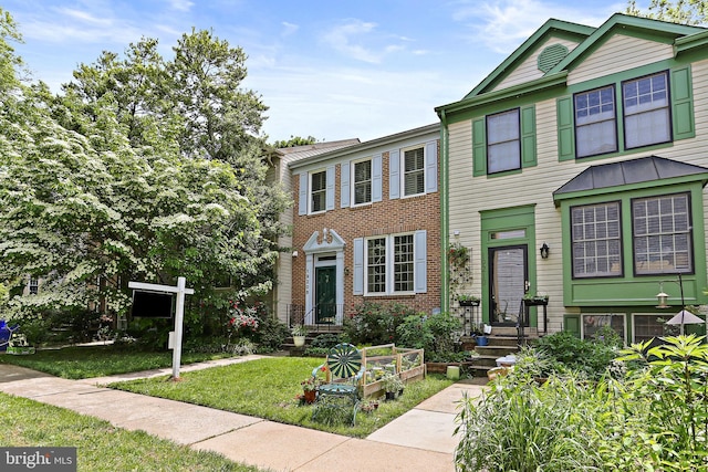 19208 Cross Ridge Dr, Germantown, MD 20874 - view of front of property featuring a front yard and brick siding