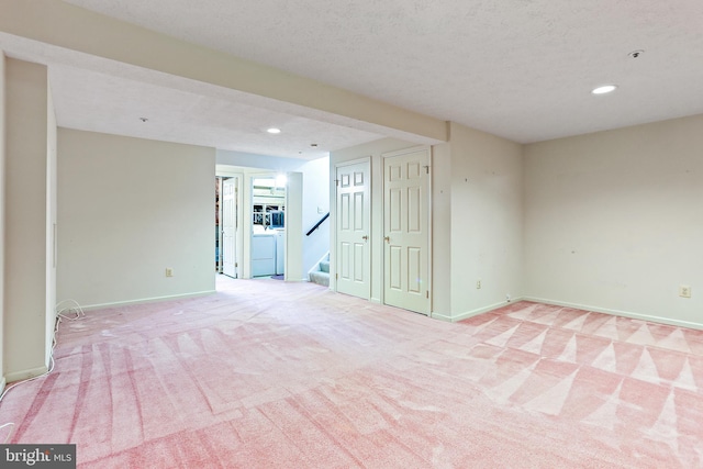 19208 Cross Ridge Dr, Germantown, MD 20874 - spare room featuring recessed lighting, light carpet, baseboards, washer / clothes dryer, and stairway