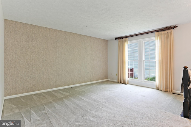 19208 Cross Ridge Dr, Germantown, MD 20874 - carpeted spare room with a textured ceiling, wallpapered walls, and baseboards