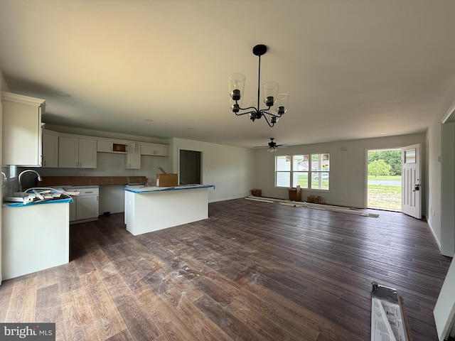 25544 Pheasant Run, Seaford, DE 19973 - kitchen featuring a chandelier, dark wood finished floors, open floor plan, and a sink