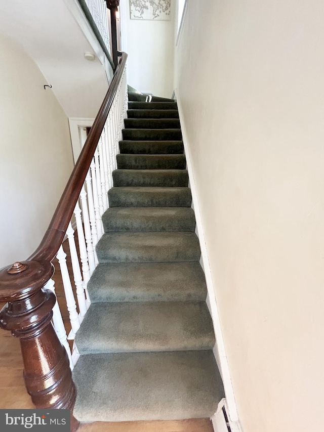 stairs with wood finished floors