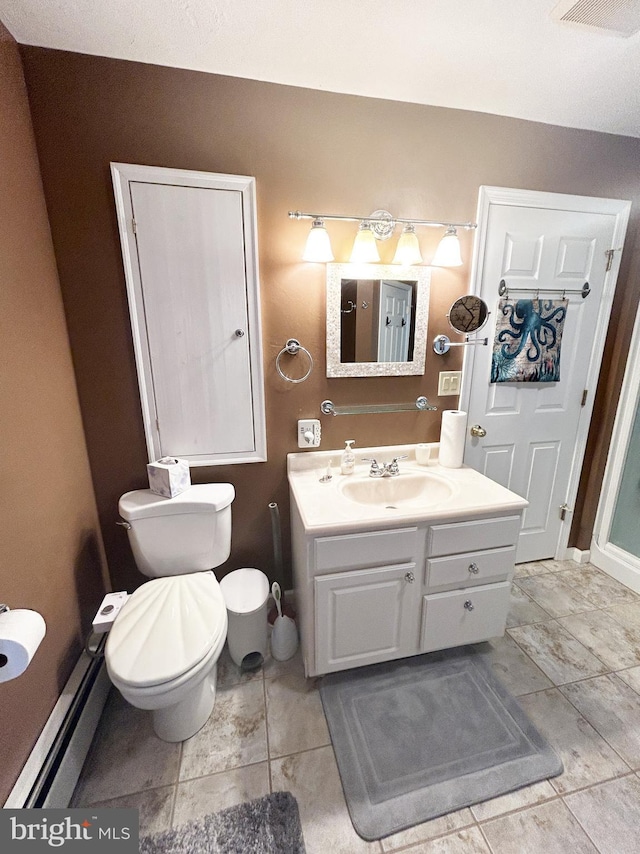 bathroom with toilet, a baseboard heating unit, vanity, visible vents, and tile patterned floors