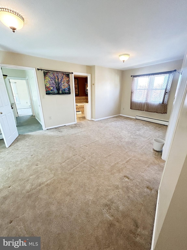 unfurnished living room with baseboards, a baseboard radiator, and carpet flooring