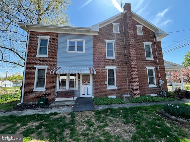 view of front of property featuring brick siding