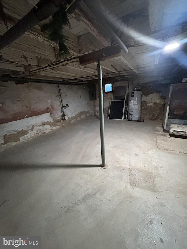 unfinished basement with gas water heater
