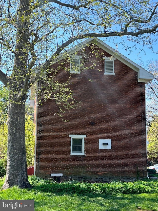 view of home's exterior featuring brick siding