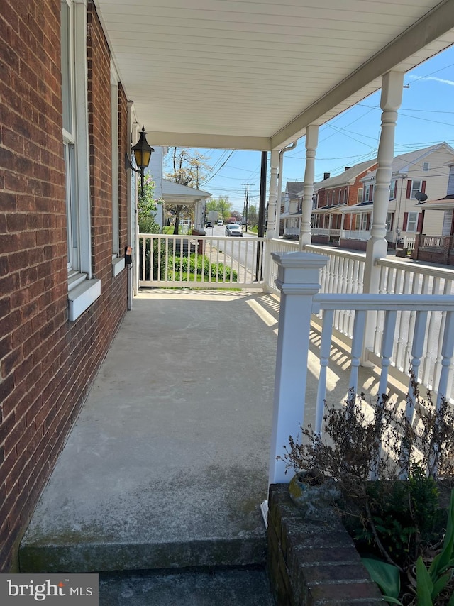 view of patio with a porch and a residential view