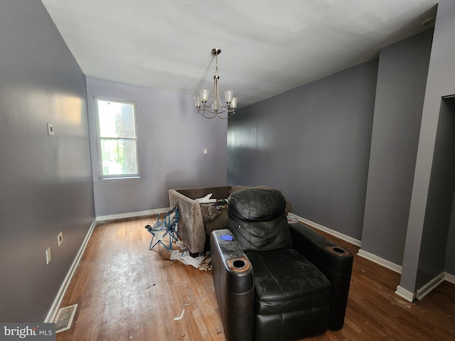 1904 Kennedy Ave, Baltimore, MD 21218 - dining area with baseboards, wood-type flooring, an inviting chandelier, and visible vents