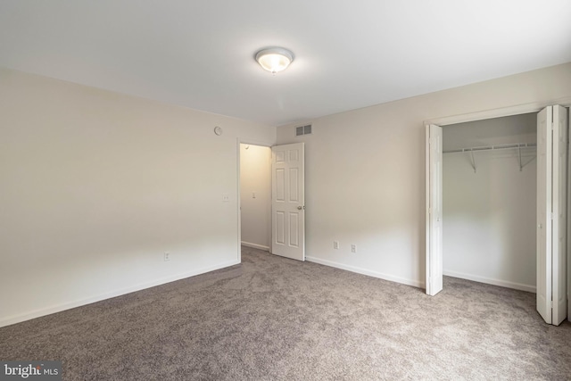 626 Milford Neck Rd, Milford, DE 19963 - unfurnished bedroom featuring carpet floors, a closet, and baseboards