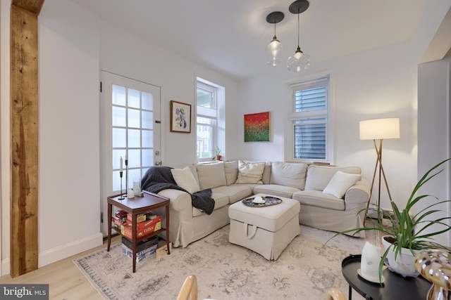 living room with wood finished floors and baseboards