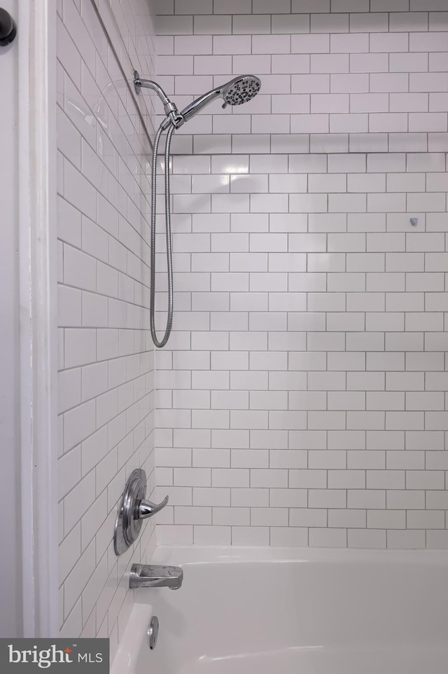 bathroom with shower / bath combination