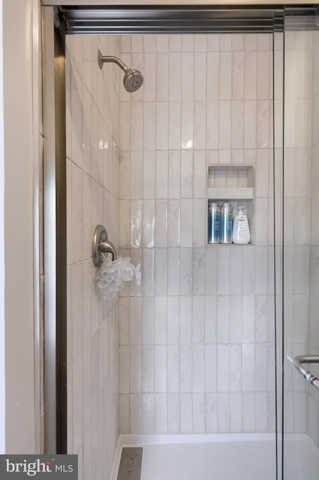 full bathroom with a shower stall