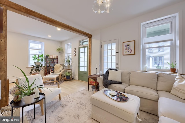 living room featuring light wood-style flooring and recessed lighting