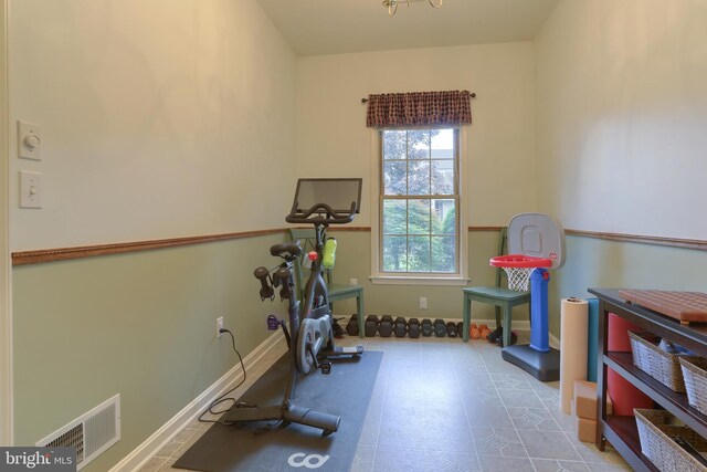 exercise room with baseboards