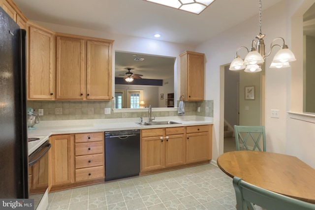 kitchen with a sink, black appliances, light countertops, decorative backsplash, and recessed lighting
