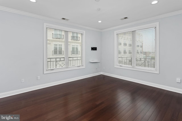 unfurnished room featuring healthy amount of natural light, hardwood / wood-style flooring, baseboards, recessed lighting, and crown molding