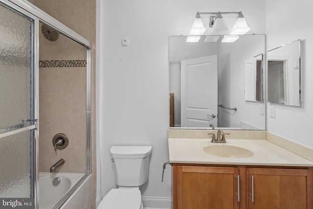 full bath with toilet, vanity, and enclosed tub / shower combo