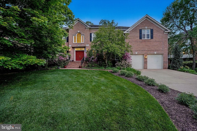 view of front facade with brick siding, concrete driveway, a garage, and a front lawn