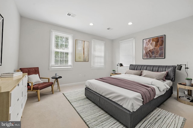 bedroom featuring light colored carpet, baseboards, and recessed lighting