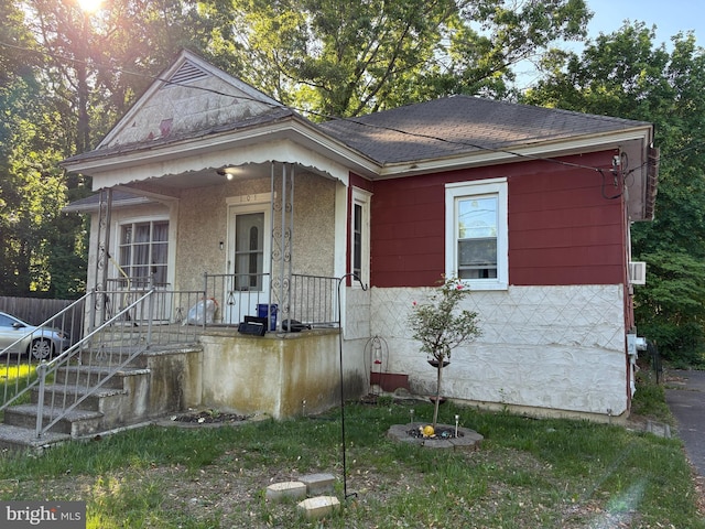 view of front of house with roof with shingles