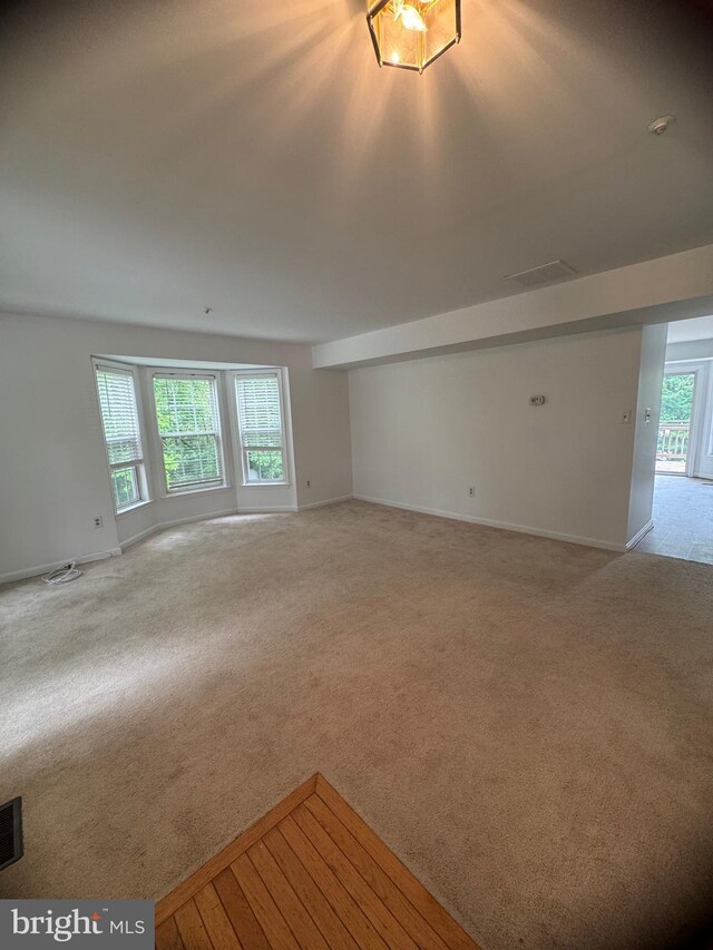 515 Primus Ct, Frederick, MD 21703 - unfurnished living room featuring light carpet and baseboards