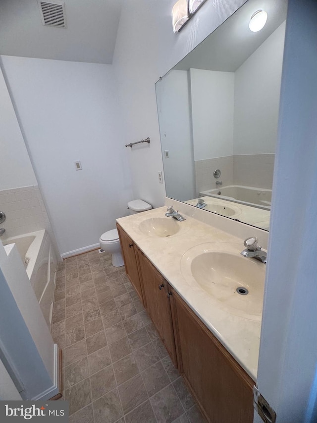 515 Primus Ct, Frederick, MD 21703 - bathroom with a bath, double vanity, toilet, and baseboards