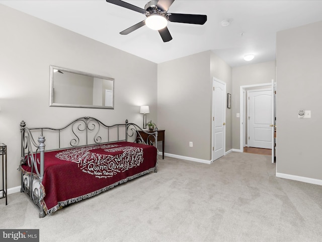 bedroom with carpet floors, baseboards, and a ceiling fan