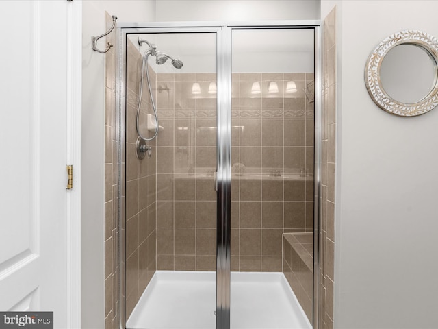 bathroom with a shower stall