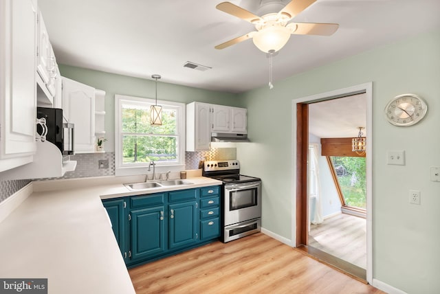 11080 Burwell Rd, Nokesville, VA 20181 - kitchen featuring a sink, appliances with stainless steel finishes, blue cabinets, and plenty of natural light