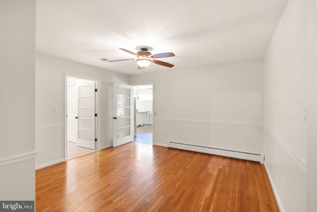 11080 Burwell Rd, Nokesville, VA 20181 - unfurnished room with a baseboard heating unit, a ceiling fan, and wood finished floors