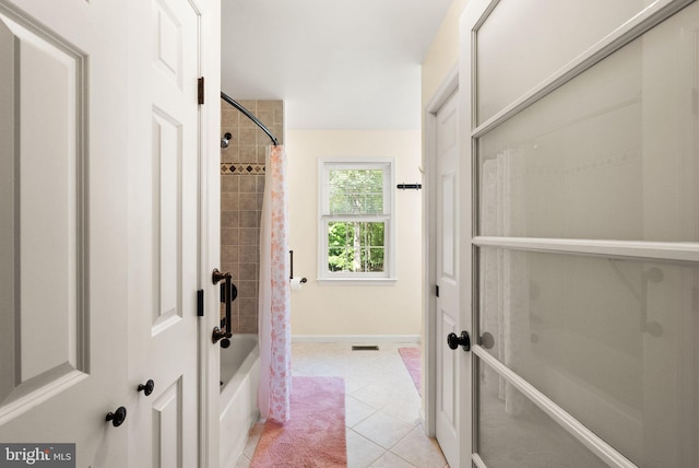 11080 Burwell Rd, Nokesville, VA 20181 - bathroom featuring shower / tub combo with curtain, tile patterned floors, and baseboards