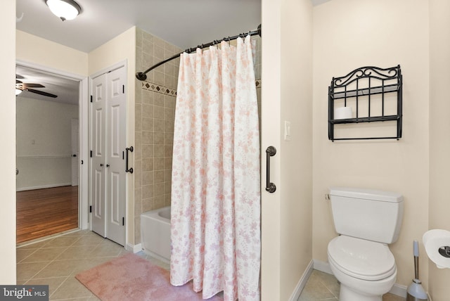 11080 Burwell Rd, Nokesville, VA 20181 - bathroom with tile patterned flooring, shower / bath combination with curtain, toilet, ceiling fan, and baseboards