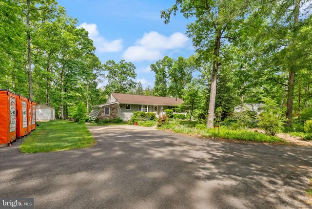 11080 Burwell Rd, Nokesville, VA 20181 - view of front facade with driveway, stone siding, and a front yard