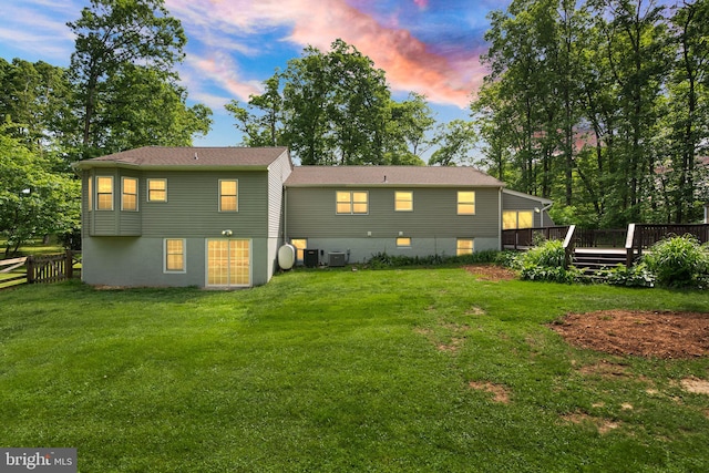 11080 Burwell Rd, Nokesville, VA 20181 - back of property at dusk featuring a wooden deck and central AC unit