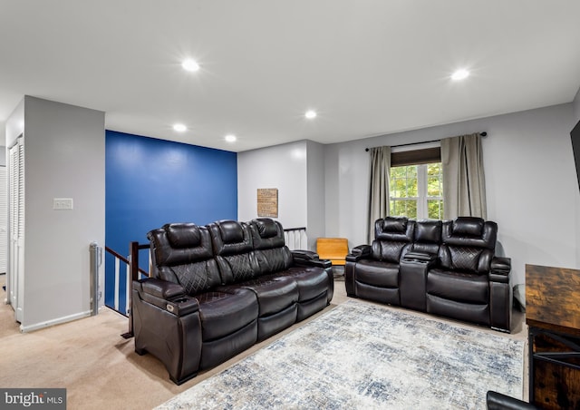 carpeted living room with recessed lighting and baseboards
