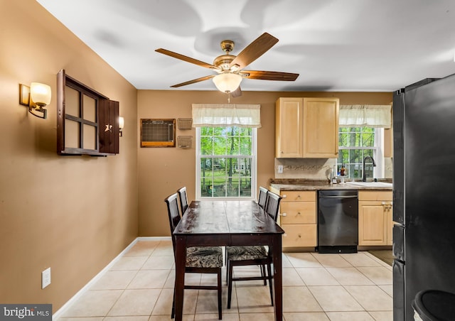 kitchen featuring light brown cabinets, dishwasher, freestanding refrigerator, a sink, and ceiling fan