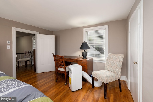 bedroom featuring wood finished floors